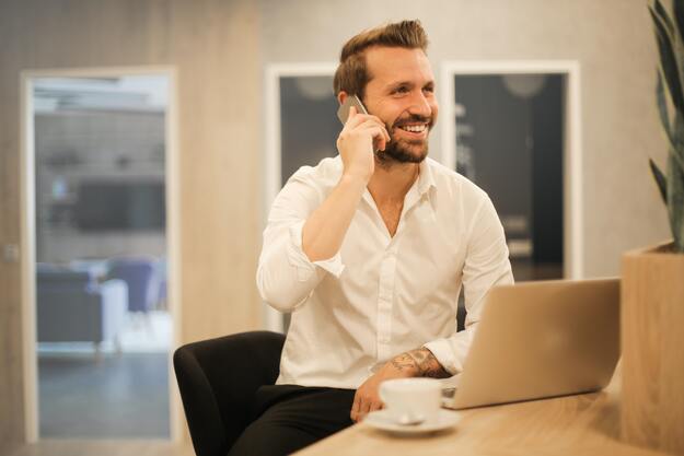blond bearded man talking on the phone | Build Up Relationship