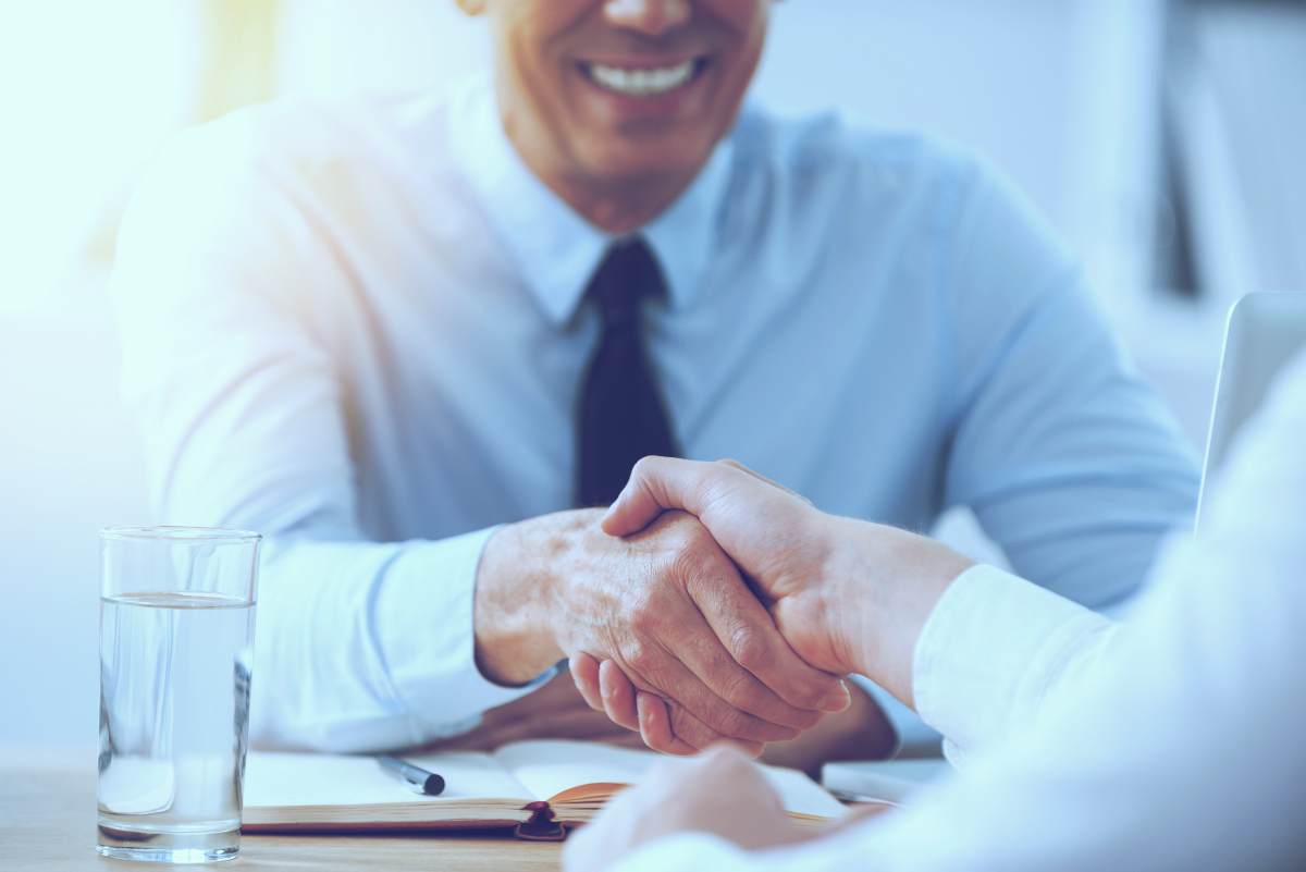 Happy businessman closing deal | What 500 Buyers Say About the Buying Process