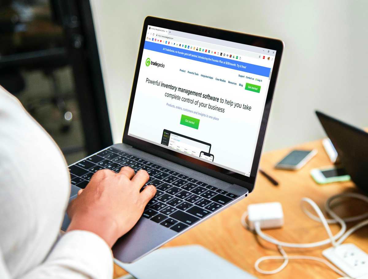 person holding computer laptop | Best Sales Software Systems For Your Business | sales tracking software