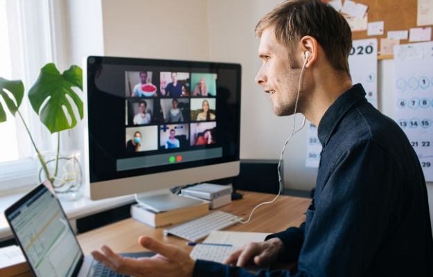 Young man having video call via computer in the home office | Stay with your teams | What 3 Top SDR Leaders Are Doing Right Now